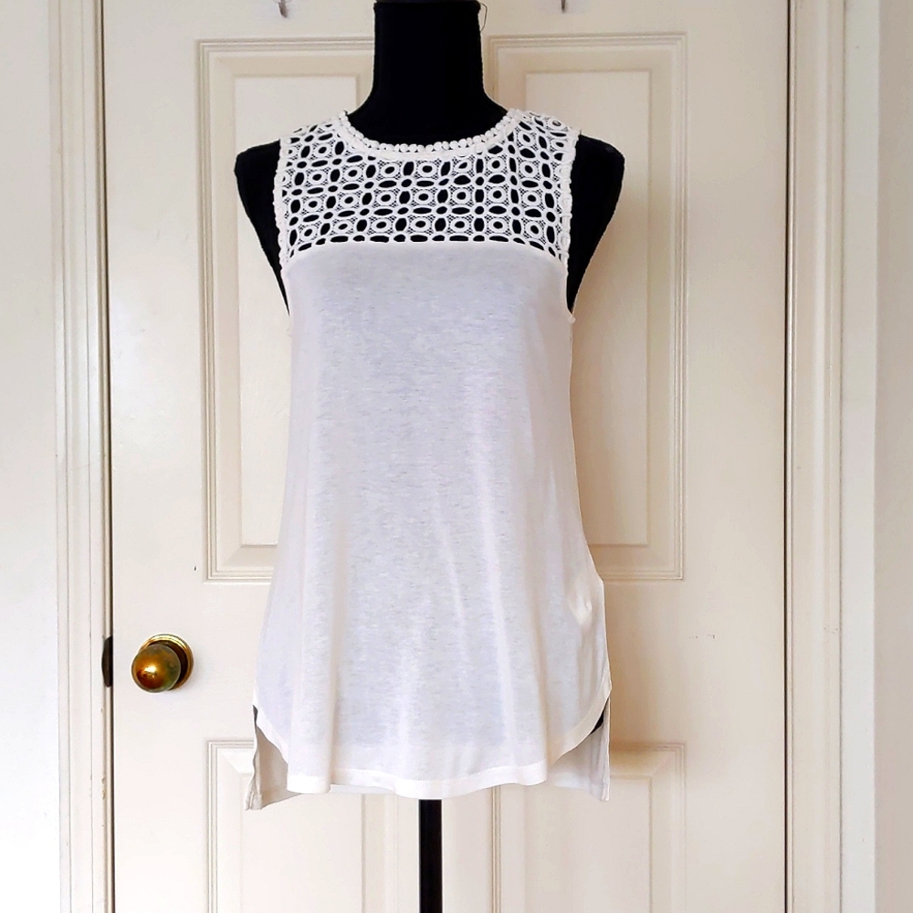 NWT. H&M 100% Rayon Sleeveless Blouse with Front design.